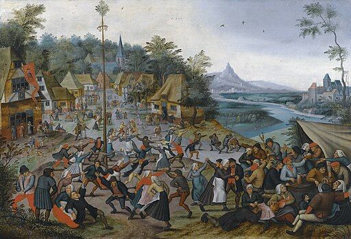 A paiting showing people dancing around a maypole in the Netherlands in the 16th century.